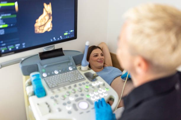 Pregnant woman having a 4D ultrasound at obstetrician office